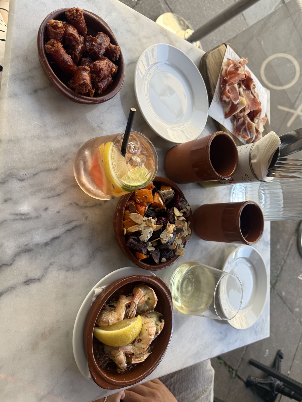 An overhead view of a tapas lunch spread across a cafe table in Bath