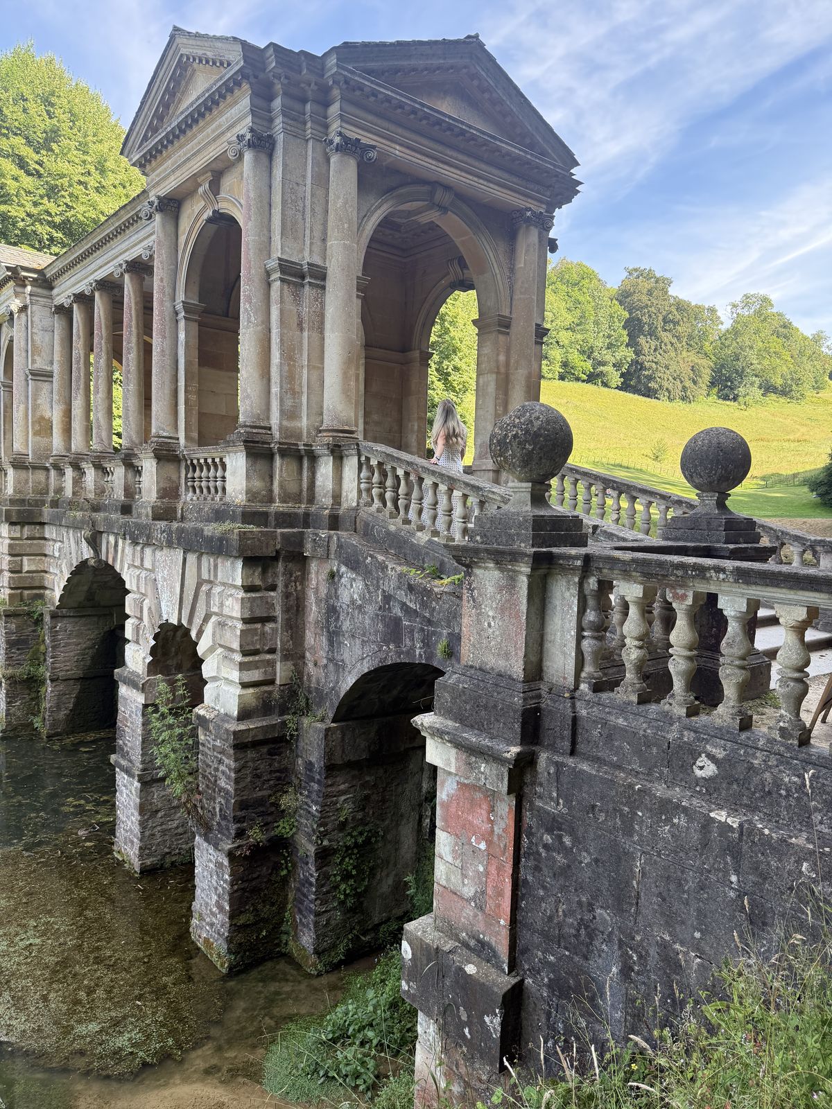 The Palladian Bridge at Prior Park in Bath, a covered stone bridge crossing the lake