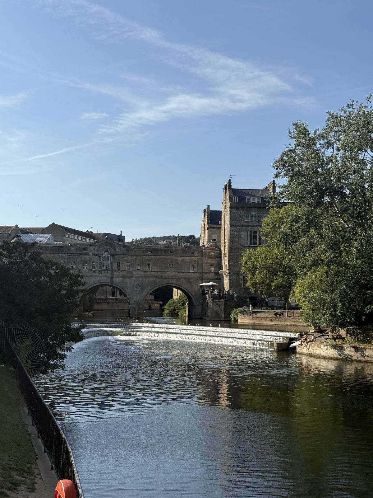 Pulteney Bridge spanning the River Avon in Bath, with shops built along its full length