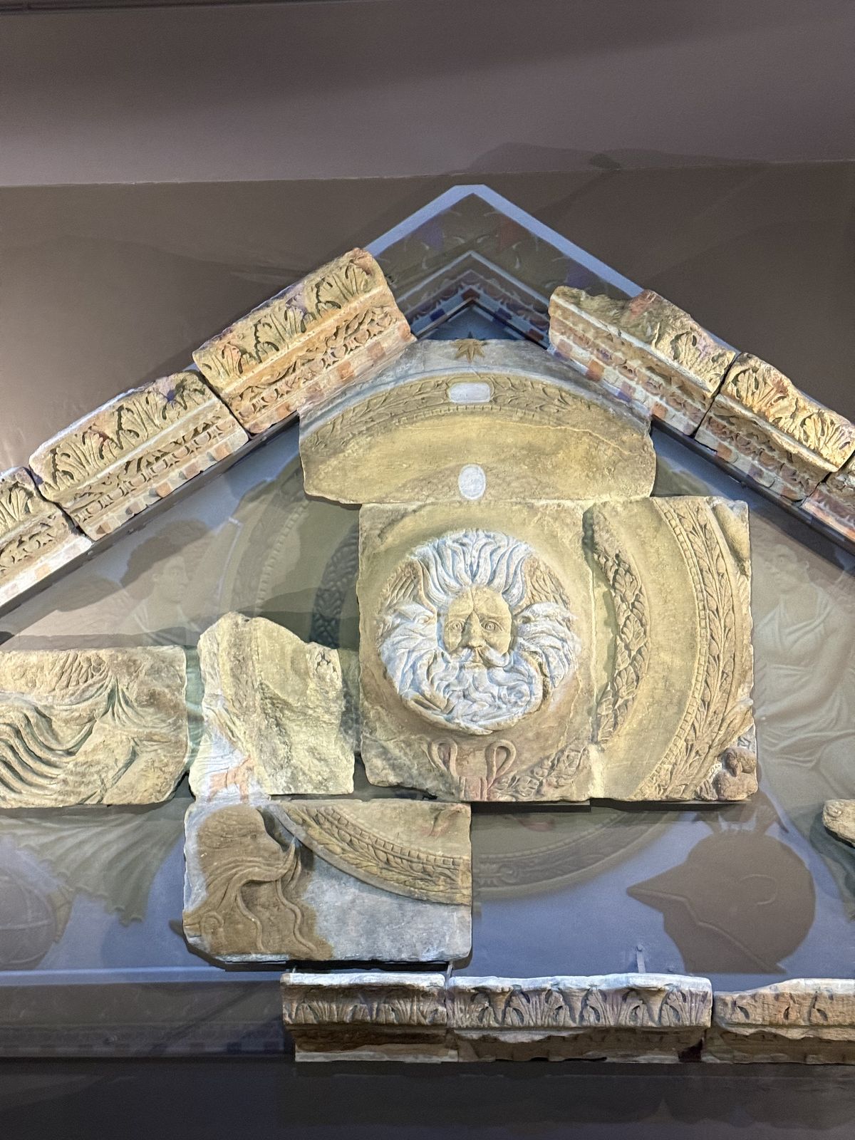 The carved Gorgon's head from the Temple pediment at the Roman Baths in Bath