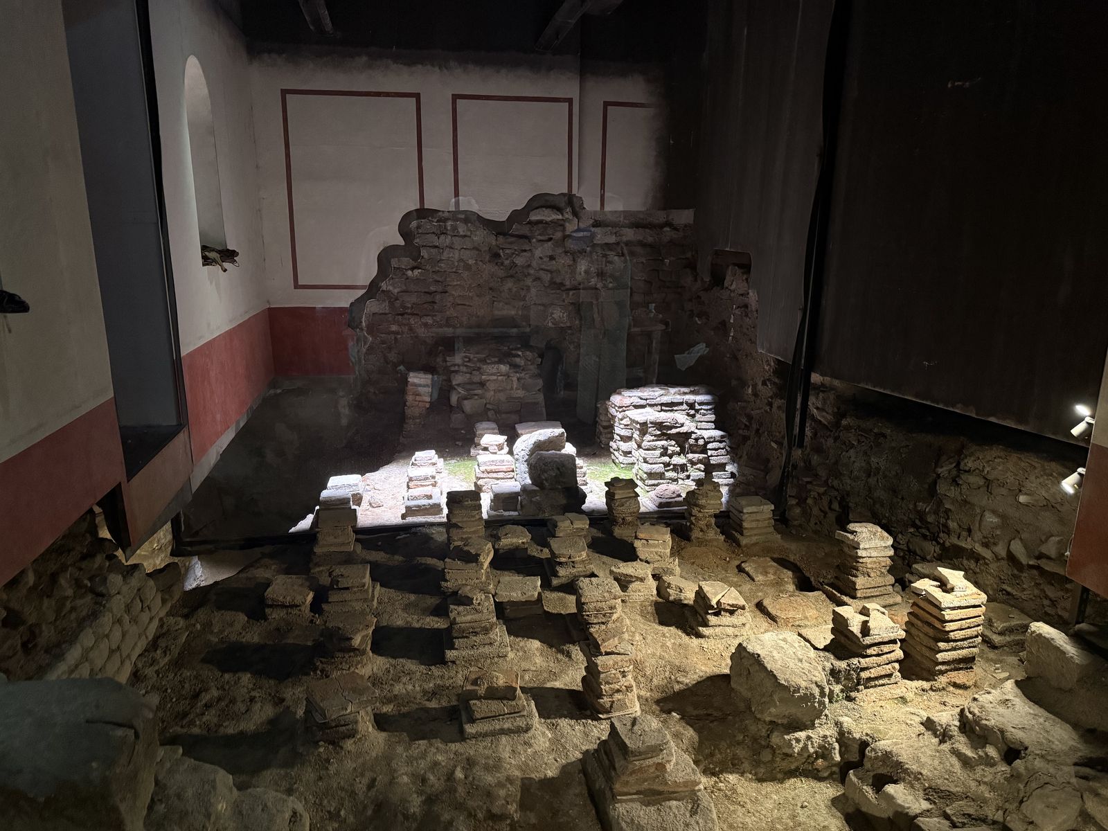 Steaming thermal water rushing through the Roman drain overflow at the Roman Baths