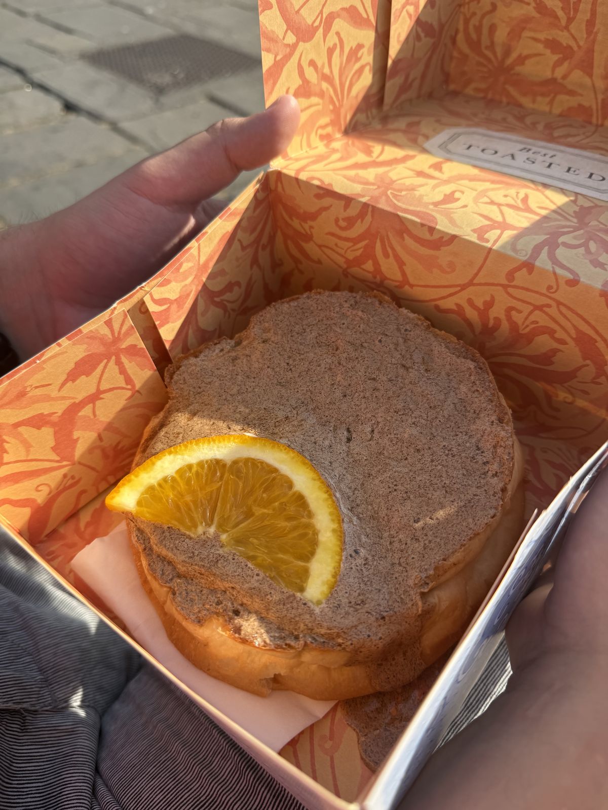 A toasted Sally Lunn bun served on a plate in Bath